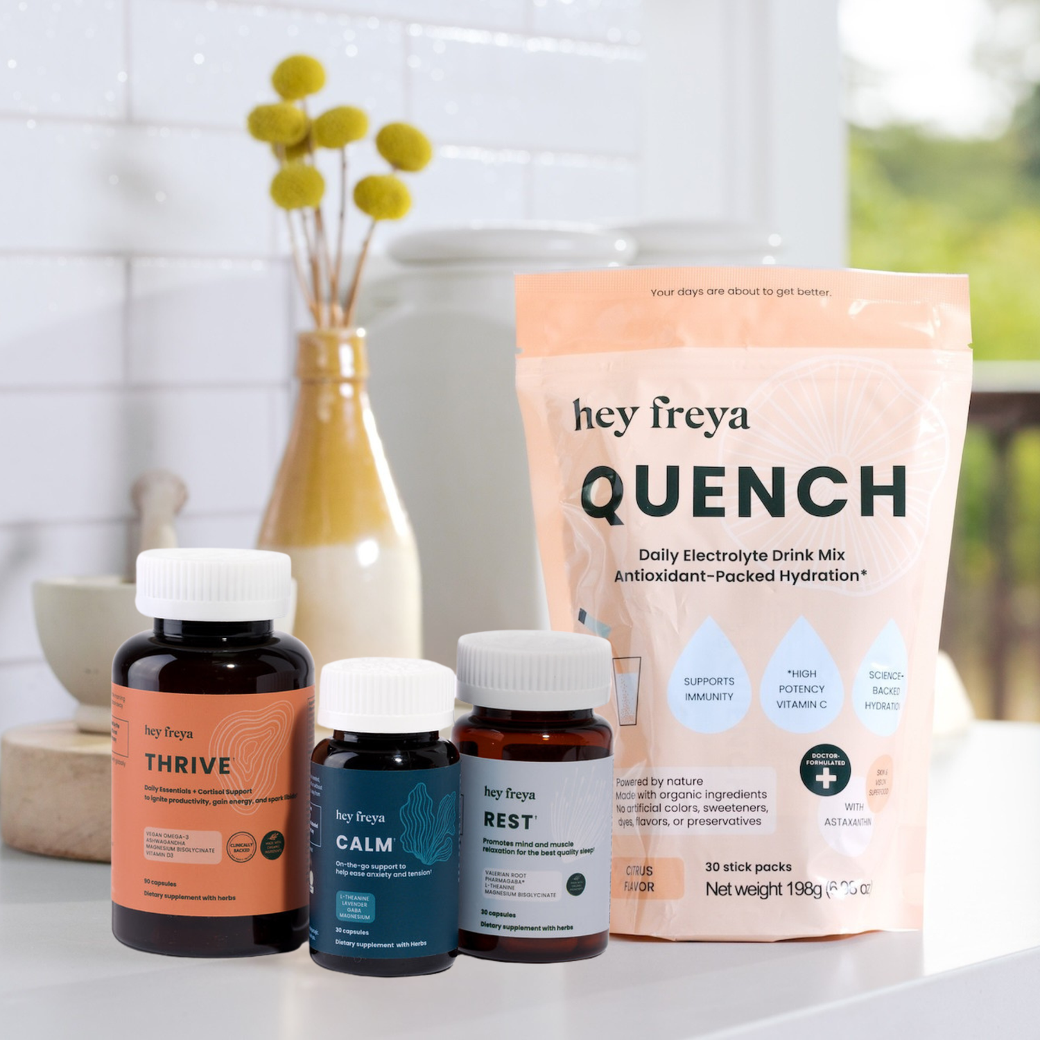 Hey Freya health and wellness products including bottles and a package on a table.